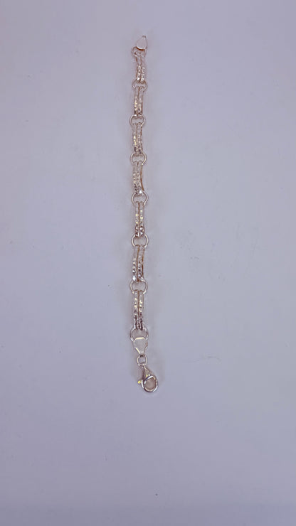 Five-heart drop necklace laid flat