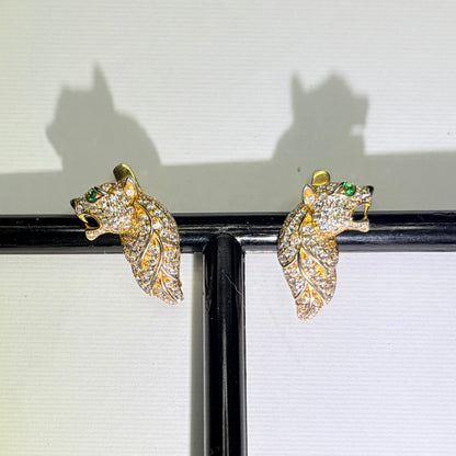 Original photo of gold-tone feline earrings with green accents