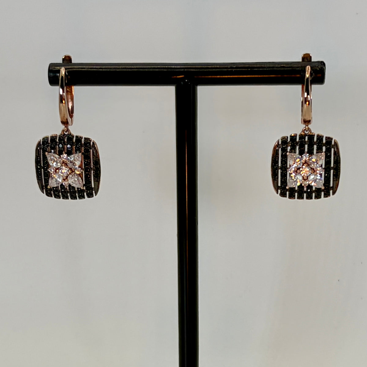 Original close-up of rose-gold square onyx drop earrings with clustered diamond centers