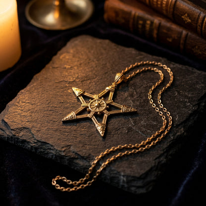 Ornate gold-plated pentagram pendant necklace with decorative tips and circular center detail.