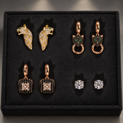 Illustrative group scene of four distinct earring pairs on black velvet