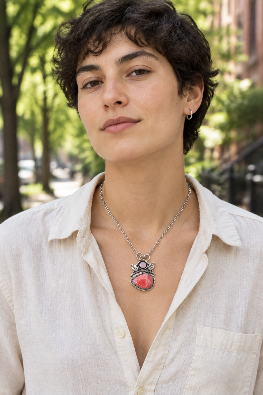 Pink pendant on a tree-lined city street